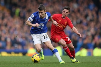 LIVERPOOL, ENGLAND - NOVEMBER 23:  Seamus Coleman of Everton competes with Joe Allen of Liverpool during the Barclays Premier League match between Everton and Liverpool at Goodison Park on November 23, 2013 in Liverpool, England.  (Photo by Clive Brunskil