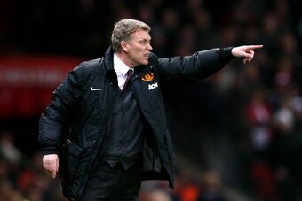 MANCHESTER, ENGLAND - JANUARY 22:  David Moyes the Manchester United manager directs his players during the Capital One Cup semi final, second leg match between Manchester United and Sunderland at Old Trafford on January 22, 2014 in Manchester, England.  