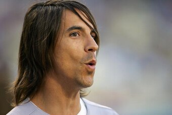 LOS ANGELES, CA - AUGUST 16:  Red Hot Chili Peppers singer Anthony Keidis looks on before throwing the ceremonial first pitch prior to the MLB game between the Milwaukee Brewers and the Los Angeles Dodgers at Dodger Stadium on August 16, 2008 in Los Angel