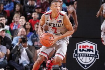 PORTLAND, OR - APRIL 20: Dante Exum #7 on the World Select Team drives against the USA Junior Select Team during the game on April 20, 2013 at the Rose Garden Arena in Portland, Oregon. NOTE TO USER: User expressly acknowledges and agrees that, by downloa