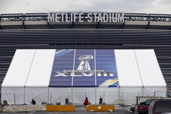 EAST RUTHERFORD, NJ - JANUARY 27:   MetLife Stadium stands behind a Super Bowl sign as the venue is prepared to host Super Bowl XLVIII between the Denver Broncos and the Seattle Seahawks January 27, 2014 in East Rutherford, New Jersey.  (Photo by Jeff Zel