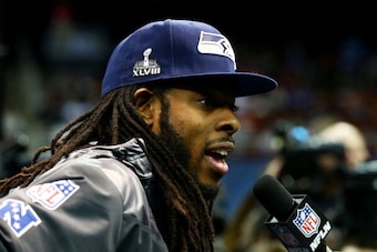 NEWARK, NJ - JANUARY 28:  Cornerback Richard Sherman #25 of the Seattle Seahawks speaks to the media during Super Bowl XLVIII Media Day at the Prudential Center on January 28, 2014 in Newark, New Jersey.  Super Bowl XLVIII will be played between the Seatt