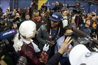 Jan 28, 2014; Newark, NJ, USA; Seattle Seahawks cornerback Richard Sherman is interviewed by Hajsan of Austrian TV during Media Day for Super Bowl XLIII at Prudential Center. Mandatory Credit: Kirby Lee-USA TODAY Sports