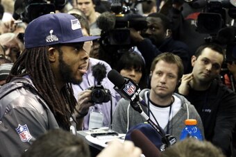 NEWARK, NJ - JANUARY 28:  Cornerback Richard Sherman #25 of the Seattle Seahawks speaks to the media during Super Bowl XLVIII Media Day at the Prudential Center on January 28, 2014 in Newark, New Jersey.  Super Bowl XLVIII will be played between the Seatt