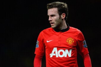 MANCHESTER, ENGLAND - JANUARY 28:  New signing Juan Mata of Manchester United looks on during the Barclays Premier League match between Manchester United and Cardiff City at Old Trafford on January 28, 2014 in Manchester, England.  (Photo by Michael Regan