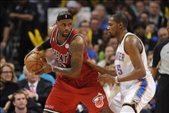 Feb 14, 2013; Oklahoma City, OK, USA; Miami Heat forward LeBron James (6) handles the ball against Oklahoma City Thunder forward Kevin Durant (35) during the second half at the Chesapeake Energy Arena.  Mandatory Credit: Mark D. Smith-USA TODAY Sports
