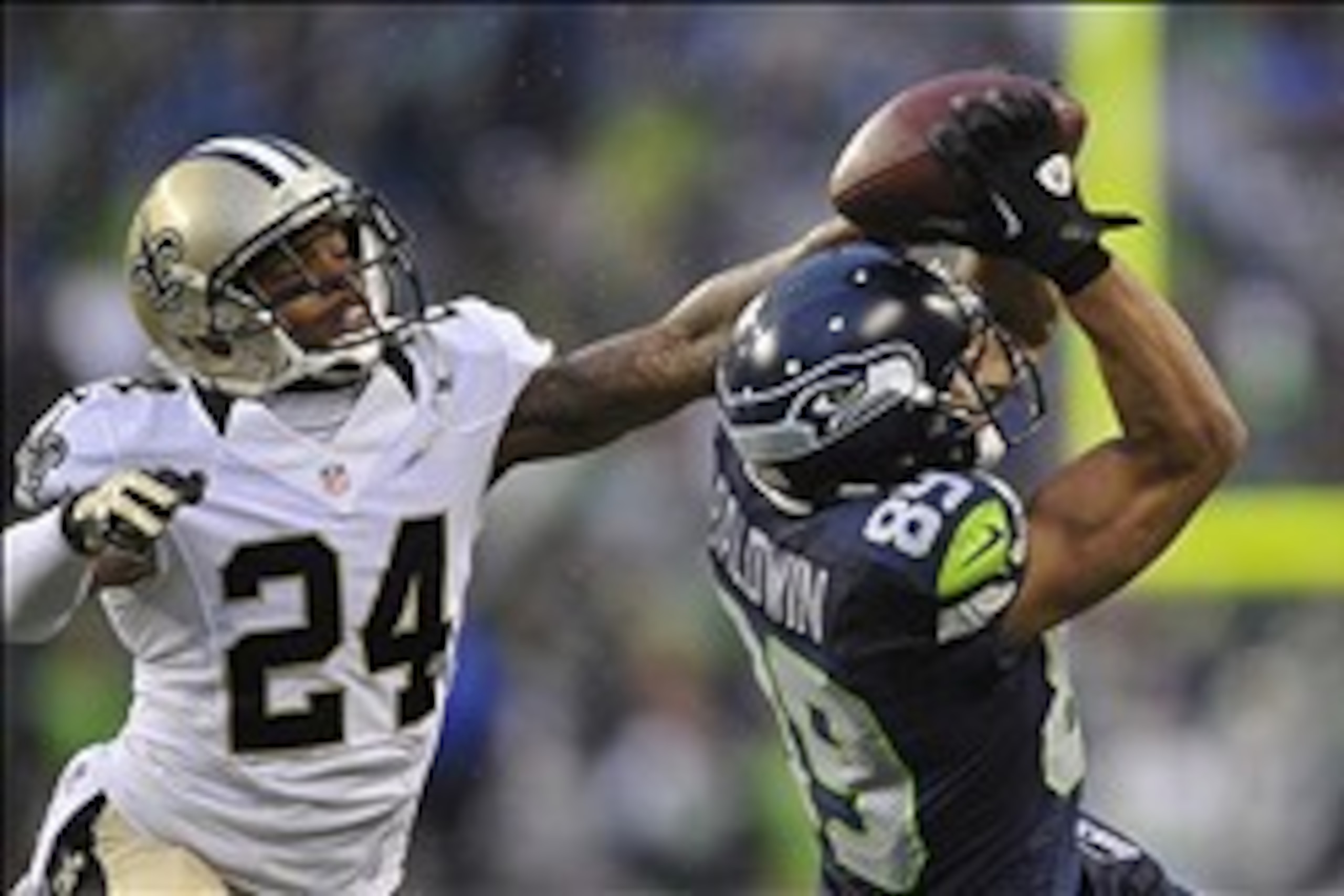 Jan 11, 2014; Seattle, WA, USA; Seattle Seahawks wide receiver Doug Baldwin (89) catches a pass against New Orleans Saints cornerback Corey White (24) during the second half of the 2013 NFC divisional playoff football game at CenturyLink Field. Mandatory 
