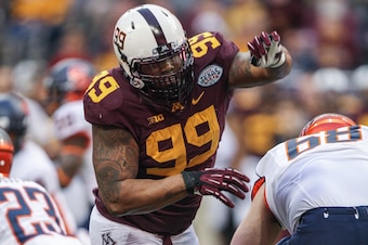Dec 27, 2013; Houston, TX, USA; Minnesota Golden Gophers defensive lineman Ra'Shede Hageman (99) rushes the quarter back during the first quarter of the Texas Bowl against the Syracuse Orange at Reliant Stadium . Mandatory Credit: Troy Taormina-USA TODAY