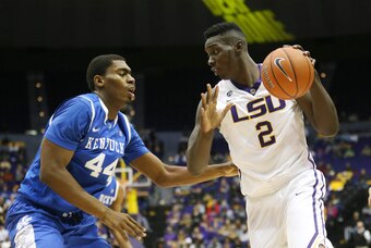 Jan 28, 2014; Baton Rouge, LA, USA; LSU Tigers forward Johnny O'Bryant III (2) is defended by Kentucky Wildcats center Dakari Johnson (44) in the first half at Pete Maravich Assembly Center. Mandatory Credit: Crystal LoGiudice-USA TODAY Sports