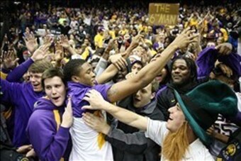 Jan 28, 2014; Baton Rouge, LA, USA; LSU Tigers guard Malik Morgan (24) celebrates with fans at Pete Maravich Assembly Center after defeating Kentucky 87-82. Mandatory Credit: Crystal LoGiudice-USA TODAY Sports