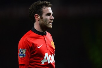 MANCHESTER, ENGLAND - JANUARY 28:  New signing Juan Mata of Manchester United looks on during the Barclays Premier League match between Manchester United and Cardiff City at Old Trafford on January 28, 2014 in Manchester, England.  (Photo by Michael Regan