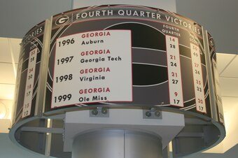 Signs with scores of all of Georgia's "4th quarter victories" adorn the weight room