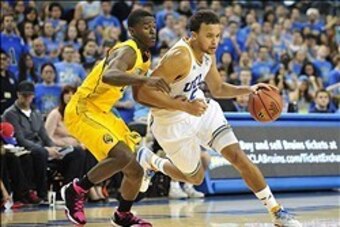 January 26, 2014; Los Angeles, CA, USA; UCLA Bruins guard/forward Kyle Anderson (5) moves the ball against the defense of California Golden Bears guard Jabari Bird (23) during the second half at Pauley Pavilion. Mandatory Credit: Gary A. Vasquez-USA TODAY
