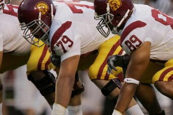 FAYETTEVILLE, AR - SEPTEMBER 2:  Sam Baker #79 and Dale Thompson #89 of the University of Southern California Trojans ready at the line of scrimmege against the Arkansas Razorbacks on September 2, 2006 at Donald W. Reynolds Razorback Stadium in Fayettevil