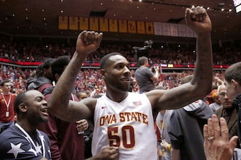 AMES, IA - NOVEMBER 17:  DeAndre Kane #50 of the Iowa State Cyclones celebrates with fans after defeating Michigan at Hilton Coliseum on November 17, 2013 in Ames, Iowa. Iowa State defeated Michigan 77-70. (Photo by David Purdy/Getty Images)