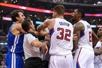 Oct 31, 2013; Los Angeles, CA, USA;   NBA referee Mark Ayotte (56) and Los Angeles Clippers power forward Blake Griffin (32) separate center DeAndre Jordan (6) after he was fouled by Golden State Warriors center Andrew Bogut (far left) in the second quart