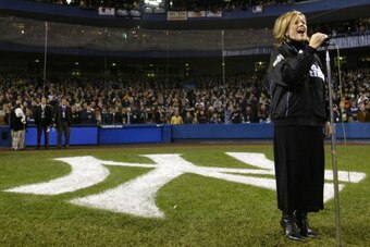 BRONX, NY - OCTOBER 19:  Soprano Renee Fleming sings the national anthem prior to game 2 of the Major League Baseball World Series between the New York Yankees and the Florida Marlins on October 19, 2003 at Yankee Stadium in the Bronx, New York.  (Photo b