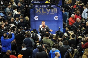 NEWARK, NJ - JANUARY 28:  Quarterback Peyton Manning #18 of the Denver Broncos speaks to the media during Super Bowl XLVIII Media Day at the Prudential Center on January 28, 2014 in Newark, New Jersey.  Super Bowl XLVIII will be played between the Seattle
