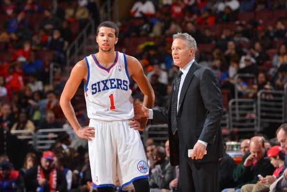 PHILADELPHIA, PA - JANUARY 24: Michael Carter-Williams #1 and Head Coach Brett Brown of the Philadelphia 76ers talk things over against the Toronto Raptors at the Wells Fargo Center on January 24, 2014 in Philadelphia, Pennsylvania. NOTE TO USER: User exp