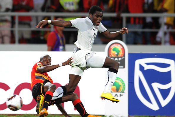 LUANDA, ANGOLA - JANUARY 24:  Opoku Agyemang of Ghana and Wilson of Angola  during the Africa Cup of Nations Quarter Final match between Angola and Ghana from the November 11 Stadium on January 24, 2010 in Luanda, Angola. (Photo by Lefty Shivambu/Gallo Im