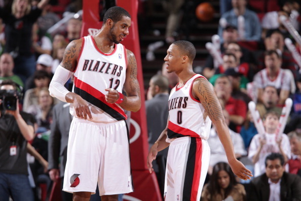 PORTLAND, OR - MARCH 16: LaMarcus Aldridge #12 of the Portland Trail Blazers and Damian Lillard #0 of the Portland Trail Blazers confer during the game between the Detroit Pistons and the Portland Trail Blazers on March 16, 2013 at the Rose Garden Arena i