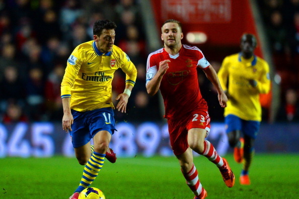 SOUTHAMPTON, ENGLAND - JANUARY 28:  Luke Shaw of Southampton closes down Mesut Oezil of Arsenal during the Barclays Premier League match between Southampton and Arsenal at St Mary's Stadium on January 28, 2014 in Southampton, England.  (Photo by Mike Hewi