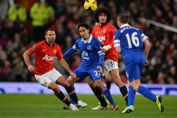 MANCHESTER, ENGLAND - DECEMBER 04:  Marouane Fellaini and Ryan Giggs (L) of Manchester United compete with Steven Pienaar of Everton during the Barclays Premier League match between Manchester United and Everton at Old Trafford on December 4, 2013 in Manc