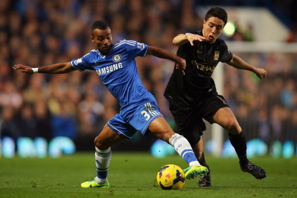 LONDON, ENGLAND - OCTOBER 27:  Ashley Cole of Chelsea and Samir Nasri of Manchester City battle for the ball during the Barclays Premier League match between Chelsea and Manchester City at Stamford Bridge on October 27, 2013 in London, England.  (Photo by