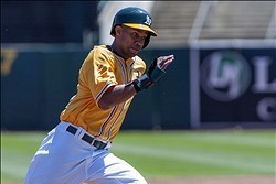 Aug 15, 2013; Oakland, CA, USA; Oakland Athletics center fielder Chris Young (25) rounds third base on a double by shortstop Jed Lowrie (not pictured) during the first inning of the game against the Houston Astros at O.Co Coliseum. Mandatory Credit: Ed Sz
