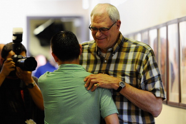 EL SEGUNDO, CA - MAY 11:  Phil Jackson, coach of the Los Angeles Lakers, hugs a Kevin Ding reporter for the Orange County Register as he leaves his last official Lakers news conference at the team's training facility on May 11, 2011 in El Segundo, Califor