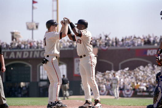 4 Oct 2000:  Barry Bonds #25 of the San Francisco Giants celebrates with teammate Jeff Kent #21 during the NLDS Game against the New York Mets at Pac Bell Park in San Francisco, California. The Giants defeated the Mets 5-1.Mandatory Credit: Tom Hauck  /Al
