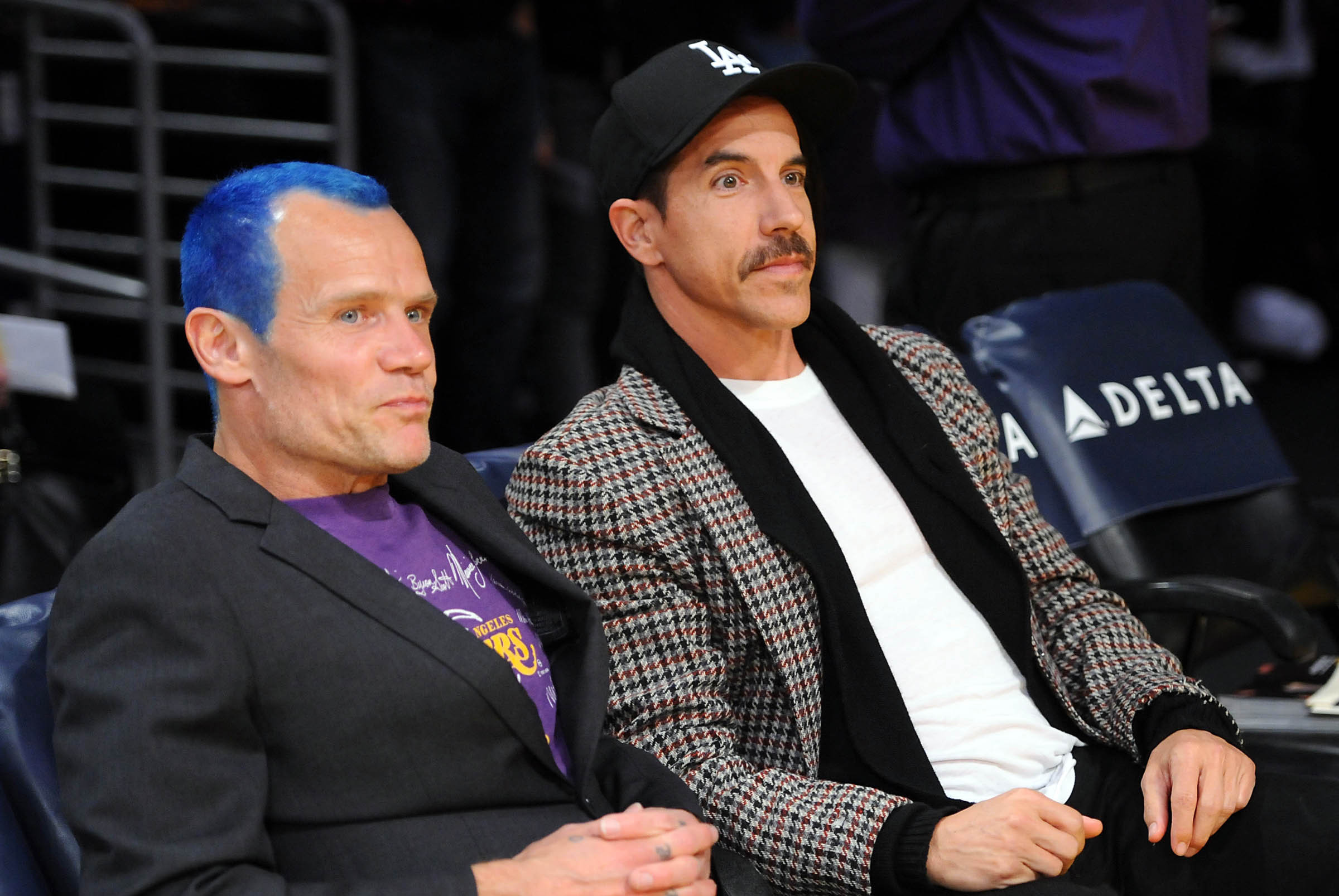 March 23, 2012; Los Angeles, CA, USA;   Recording artists Flea and Anthony Kiedis of the Red Hot Chili Peppers watch the game between the Los Angeles Lakers and the Portland Trail Blazers at the Staples Center. Lakers won 103-96. Mandatory Credit: Jayne K