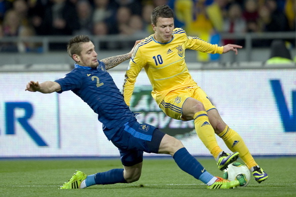 KIEV, UKRAINE - NOVEMBER 15: Mathieu Debuchy (L) of France fights for the ball with Ukraine's Yevhen Konoplyanka (R) during the FIFA 2014 World Cup Qualifier Play-off First Leg soccer match between Ukraine and France at the Olympic Stadium on November 15,