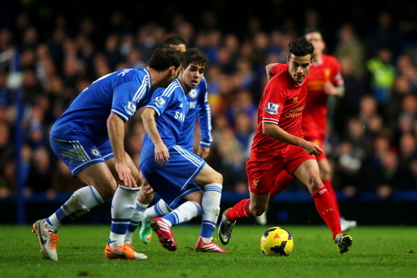 LONDON, ENGLAND - DECEMBER 29:  Philippe Coutinho of Liverpool is challenged by Branislav Ivanovic (L) and Oscar (C) of Chelsea during the Barclays Premier League match between Chelsea and Liverpool at Stamford Bridge on December 29, 2013 in London, Engla