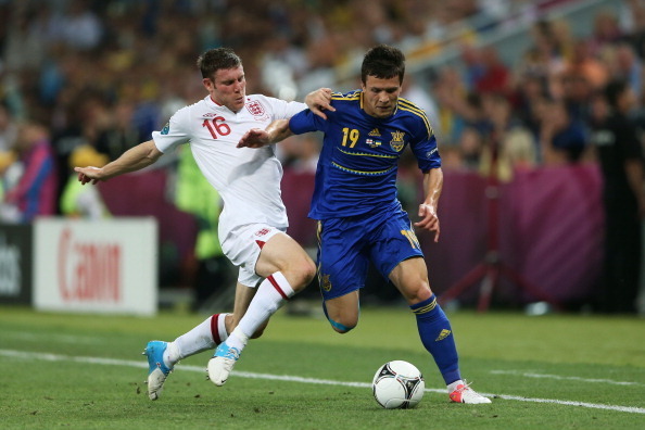 DONETSK, UKRAINE - JUNE 19:  James Milner of England and Yevhen Konoplyanka of Ukraine compete for the ball during the UEFA EURO 2012 group D match between England and Ukraine at Donbass Arena on June 19, 2012 in Donetsk, Ukraine.  (Photo by Scott Heavey/