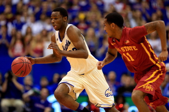 LAWRENCE, KS - JANUARY 29:  Andrew Wiggins #22 of the Kansas Jayhawks controls the ball as Monte Morris #11 of the Iowa State Cyclones defends during the game at Allen Fieldhouse on January 29, 2014 in Lawrence, Kansas.  (Photo by Jamie Squire/Getty Image
