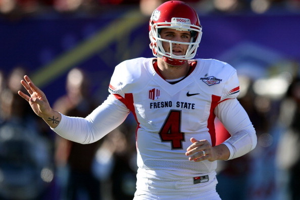 LAS VEGAS, NV - DECEMBER 21:  Quarterback Derek Carr #4 of the Fresno State Bulldogs signals teammates during the team's game against the USC Trojans in the Royal Purple Las Vegas Bowl at Sam Boyd Stadium on December 21, 2013 in Las Vegas, Nevada. USC won