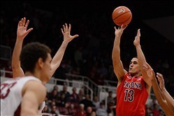 January 29, 2014; Stanford, CA, USA; Arizona Wildcats guard Nick Johnson (13) shoots the ball against Stanford Cardinal forward Dwight Powell (33) during the first half at Maples Pavilion. Mandatory Credit: Kyle Terada-USA TODAY Sports