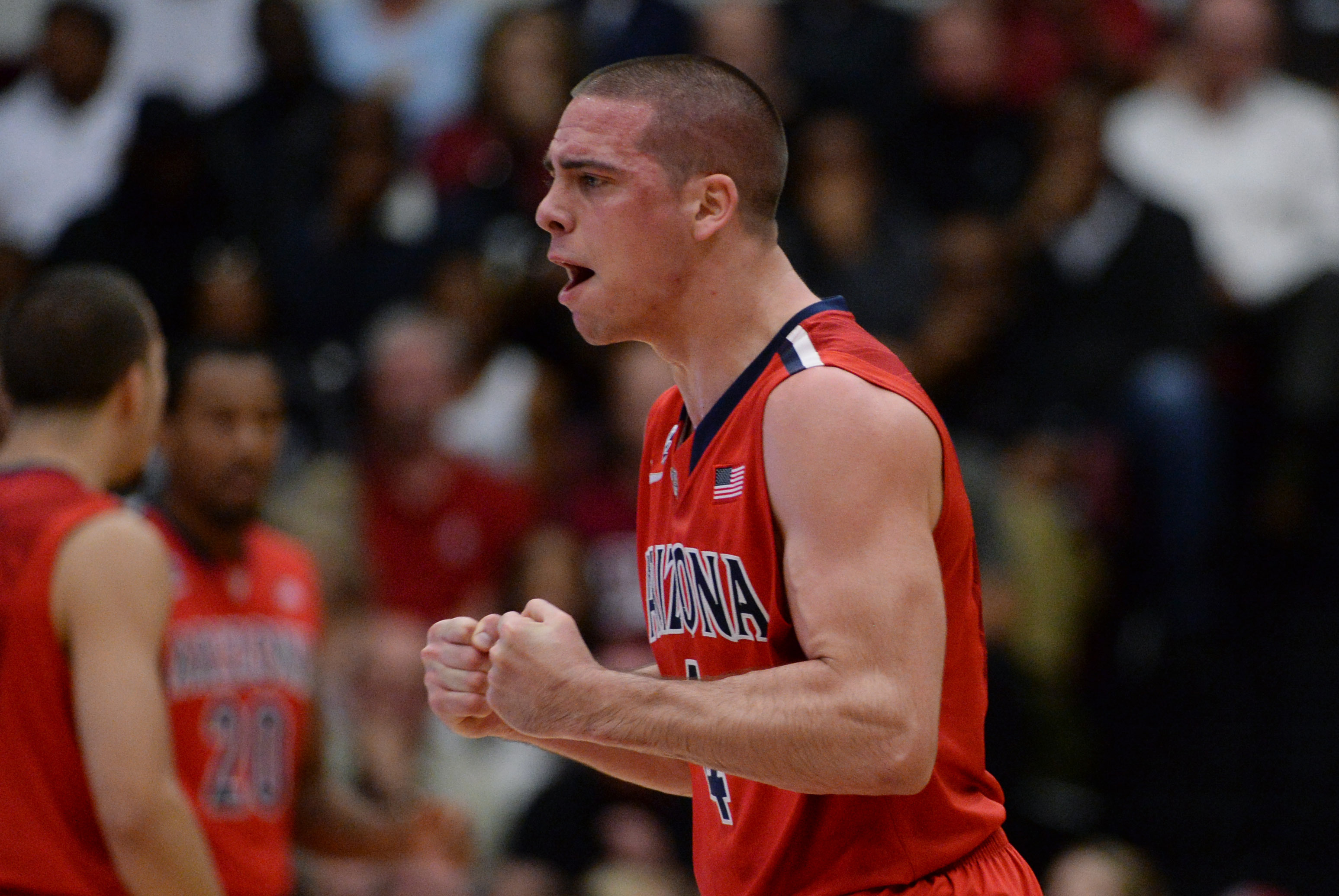 January 29, 2014; Stanford, CA, USA; Arizona Wildcats guard T.J. McConnell (4) celebrates after a basket against the Stanford Cardinal during the first half at Maples Pavilion. Mandatory Credit: Kyle Terada-USA TODAY Sports