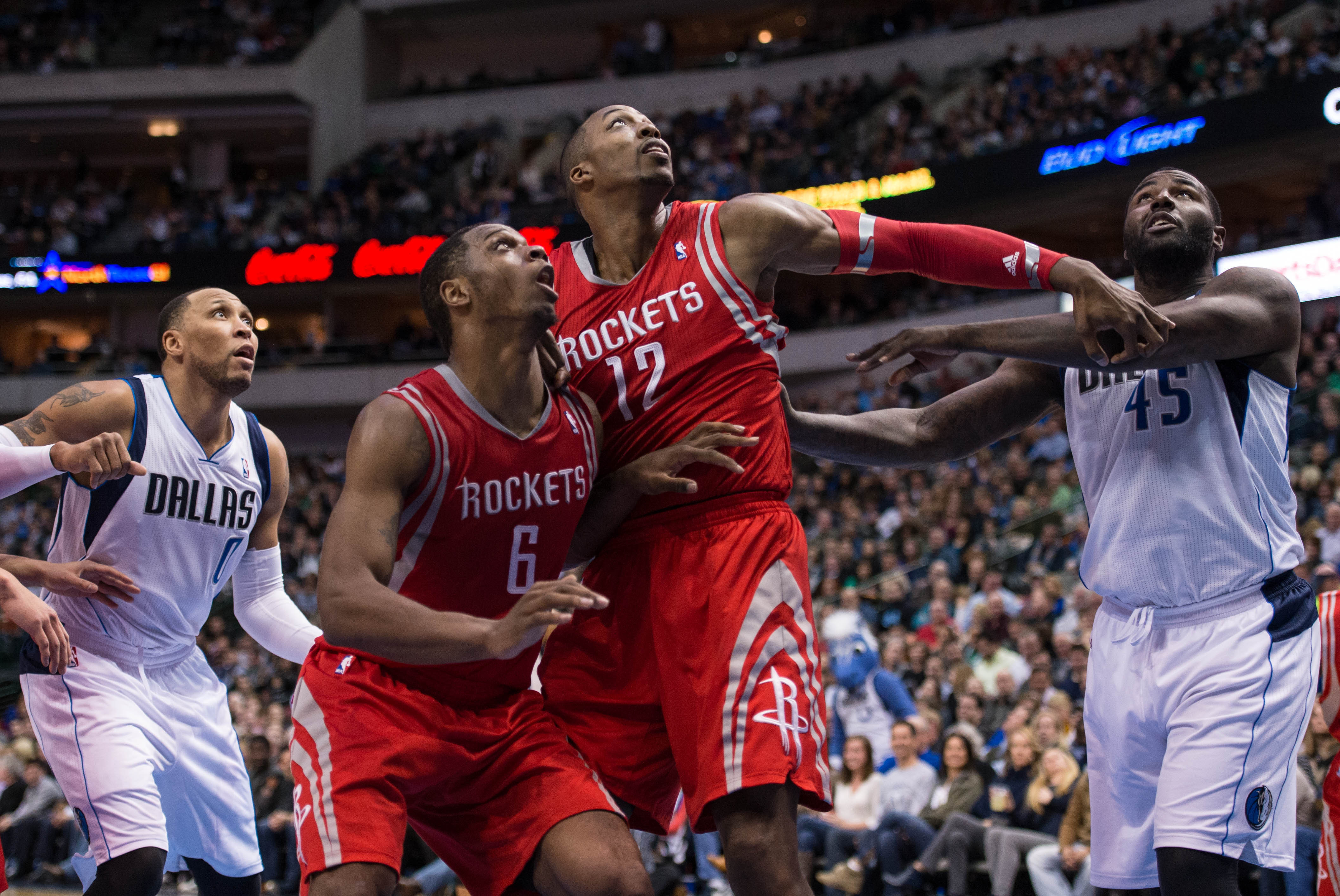 Jan 29, 2014; Dallas, TX, USA; Houston Rockets power forward Terrence Jones (6) and point guard Jeremy Lin (7) fights position with small forward Shawn Marion (0) and center DeJuan Blair (45)during the first half at the American Airlines Center. Mandatory