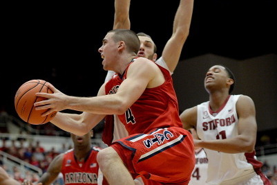 PALO ALTO, CA - JANUARY 29:  T.J. McConnell #4 of the Arizona Wildcats drives on Robbie Lemons #10 of Stanford Cardinals during the second half at Maples Pavilion on January 29, 2014 in Palo Alto, California. Arizona won the game 60-57.  (Photo by Thearon