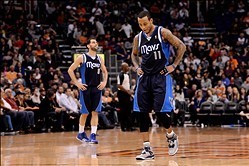 Dec 21, 2013; Phoenix, AZ, USA; Dallas Mavericks guard Monta Ellis (11) and guard Jose Calderon (8) react on the court in the second half of the game against the Phoenix Suns at US Airways Center. The Suns won 123-108.  Mandatory Credit: Jennifer Stewart-