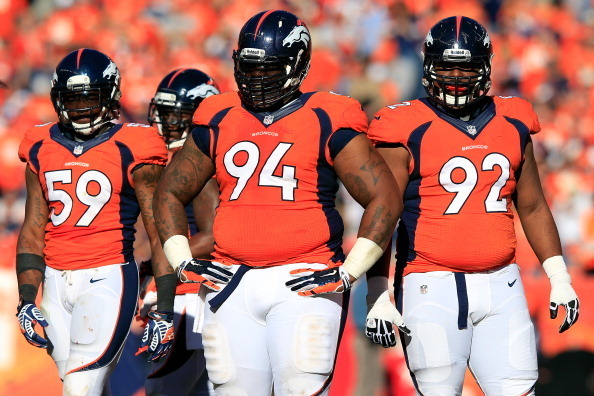 DENVER, CO - JANUARY 19:  Danny Trevathan #59 and Terrance Knighton #94 of the Denver Broncos reacts in the second quarter against the New England Patriots during the AFC Championship game at Sports Authority Field at Mile High on January 19, 2014 in Denv