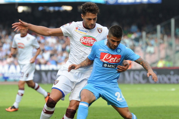 NAPLES, ITALY - OCTOBER 27: Danilo D'Ambrosio (L) of Torino challenges Lorenzo Insigne of Napoli during the Serie A match between SSC Napoli and Torino FC at Stadio San Paolo on October 27, 2013 in Naples, Italy.  (Photo by Giuseppe Bellini/Getty Images)