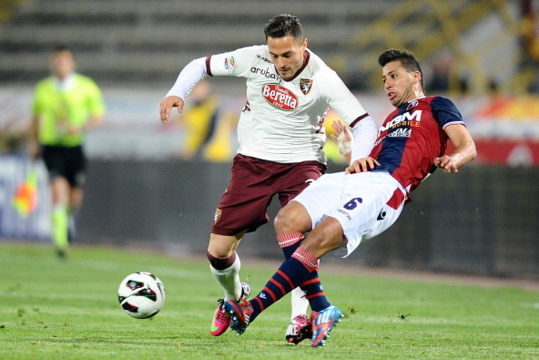 BOLOGNA, ITALY - APRIL 06:  Saphir Taider # 6 of Bologna FC ( R ) competes the ball with Danilo D'Ambrosio # 3 of Torino FC during the Serie A match between Bologna FC and Torino FC at Stadio Renato Dall'Ara on April 6, 2013 in Bologna, Italy.  (Photo by 