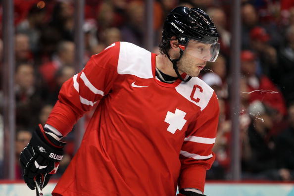 VANCOUVER, BC - FEBRUARY 23:  Mark Streit #7 of Switzerland spits during the ice hockey Men's Qualification Playoff game between Switzerland and Belarus on day 12 of the Vancouver 2010 Winter Olympics at UBC Thunderbird Arena on February 23, 2010 in Vanco