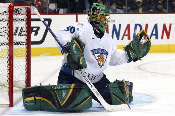 VANCOUVER, CANADA - JANUARY 2:  Tuukka Rask #30 of Team Finland makes a glove save on Team Sweden during their World Jr. Hockey Championship quarter-final game on January 2, 2006 at General Motors Place in Vancouver, British Columbia, Canada. Team Finland