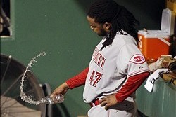 Oct 1, 2013; Pittsburgh, PA, USA; Cincinnati Reds starting pitcher Johnny Cueto (47) tosses a water bottle in the dugout after being relieved in the fourth inning of the National League wild card playoff baseball game against the Pittsburgh Pirates at PNC