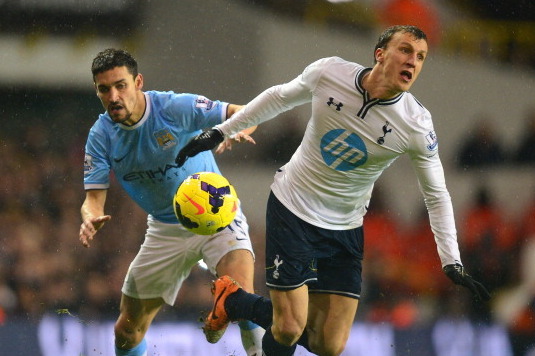 LONDON, ENGLAND - JANUARY 29:  Jesus Navas of Manchester City and Vlad Chiriches of Tottenham Hotspur battle for the ball during the Barclays Premier League match between Tottenham Hotspur and Manchester City at White Hart Lane on January 29, 2014 in Lond