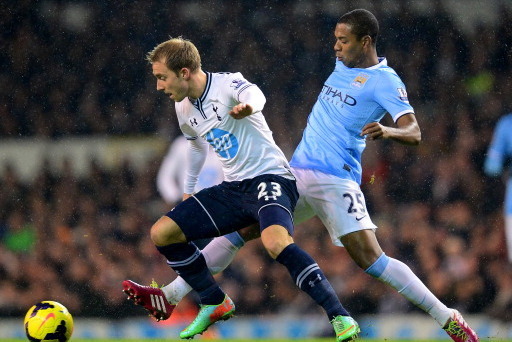 LONDON, ENGLAND - JANUARY 29:  Christian Eriksen of Tottenham Hotspur and Fernandinho of Manchester City compete for the ball during the Barclays Premier League match between Tottenham Hotspur and Manchester City at White Hart Lane on January 29, 2014 in 